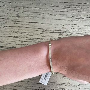 Kendra Scott gold and crystal bracelet with tassels